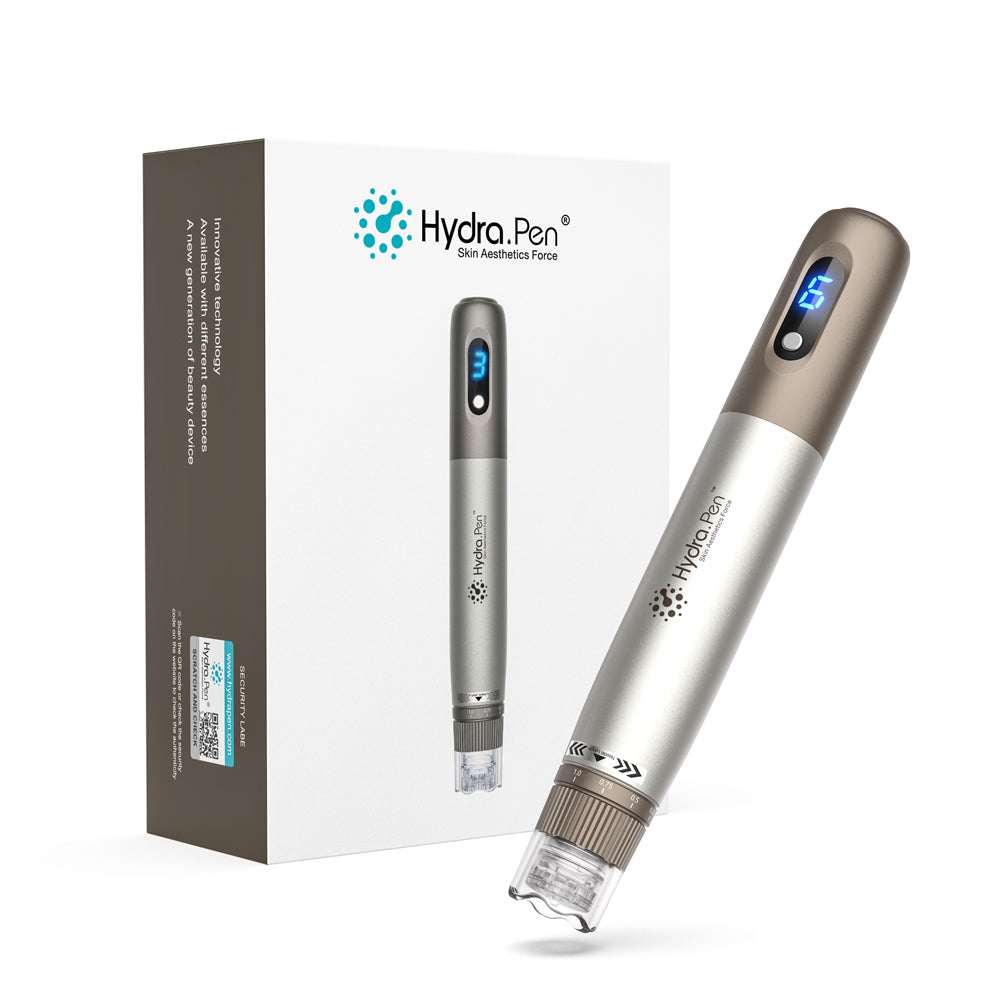 Ασημί και μπρονζέ Hydra Pen H3 δίπλα στην αρχική συσκευασία προϊόντος